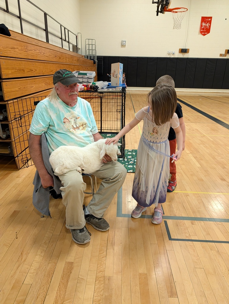 line of children petting lamb in Mr. Morton's lap