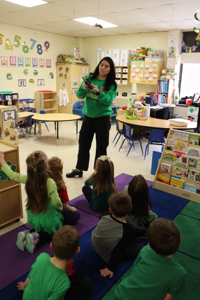 teacher shows Irish dance shoes