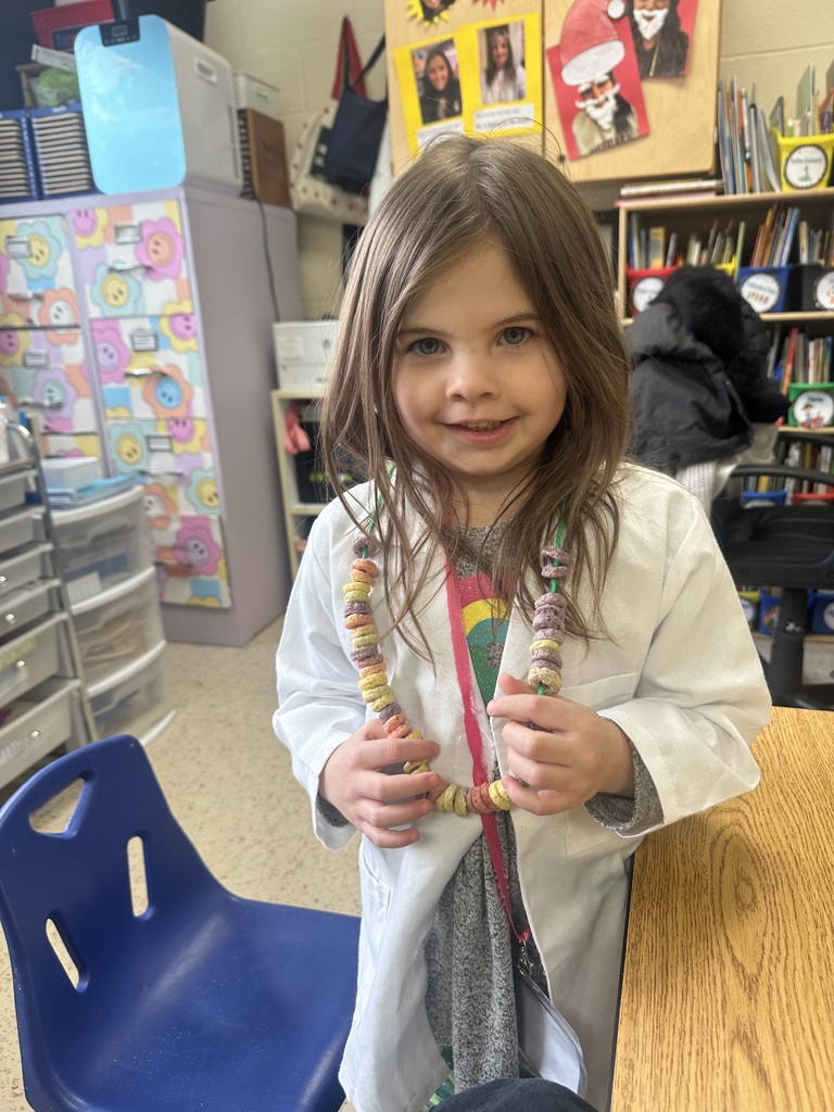 A girl wears her cereal necklace