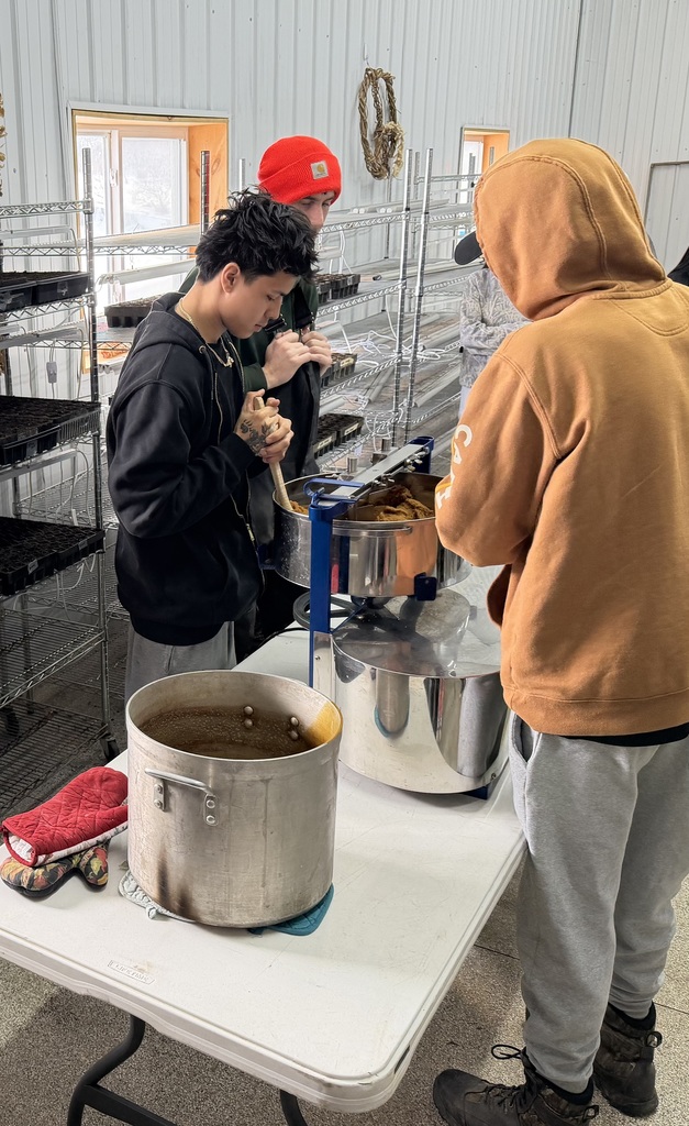 students watch sap boiling process