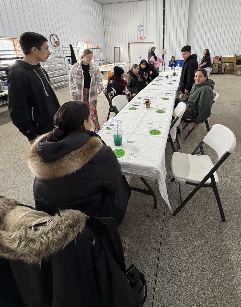 students sit at dining table