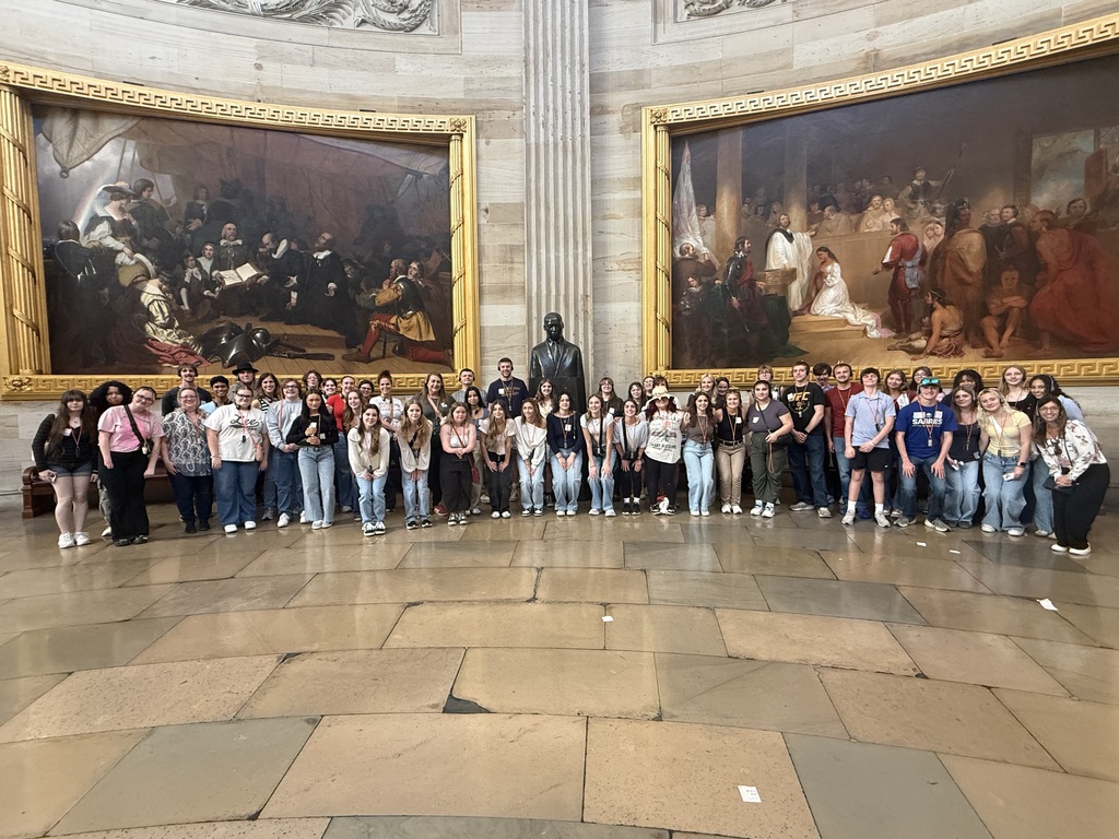 The group in the Capitol Rotunda with paintings