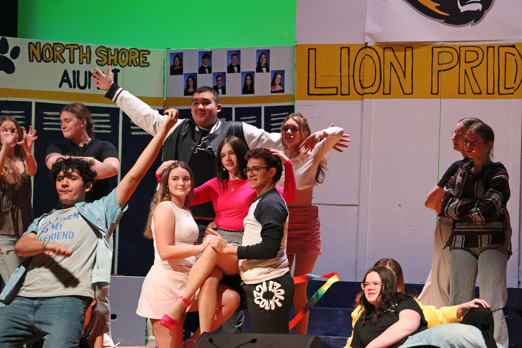 Regina is carried in a dance