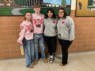Students and staff  in matching outfits