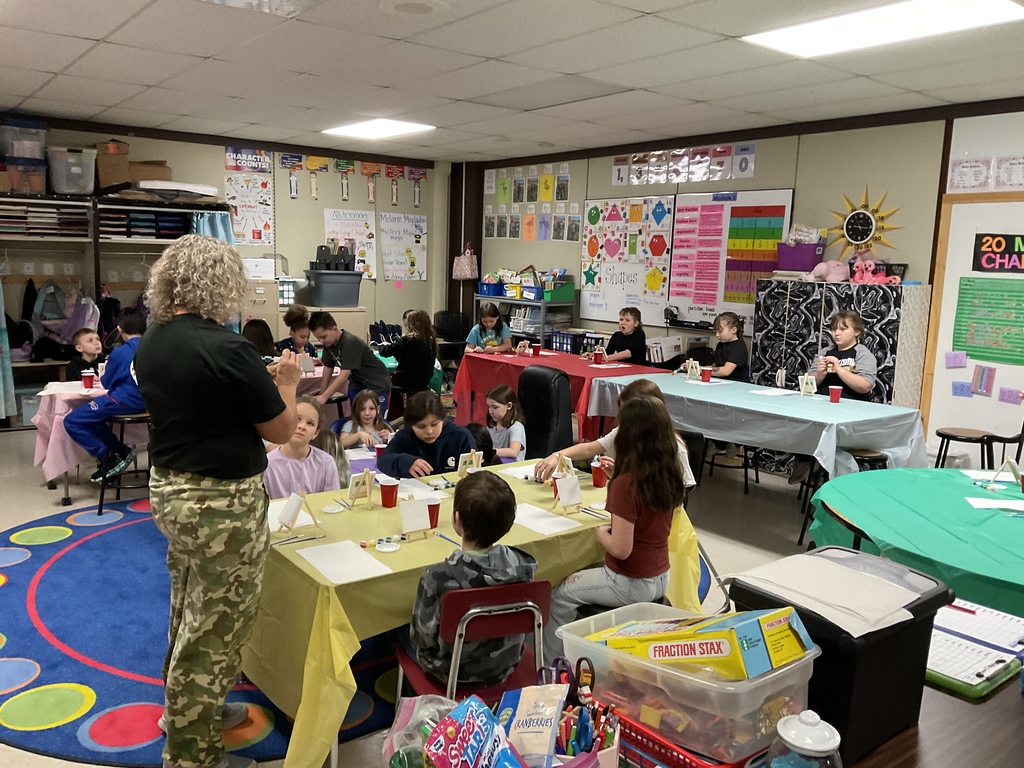 The students prepare to paint bunnies