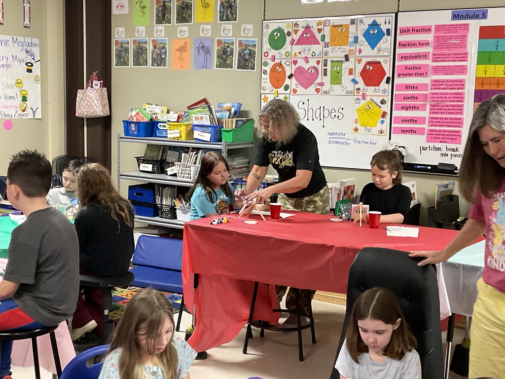 Mrs. Anderson helps the students