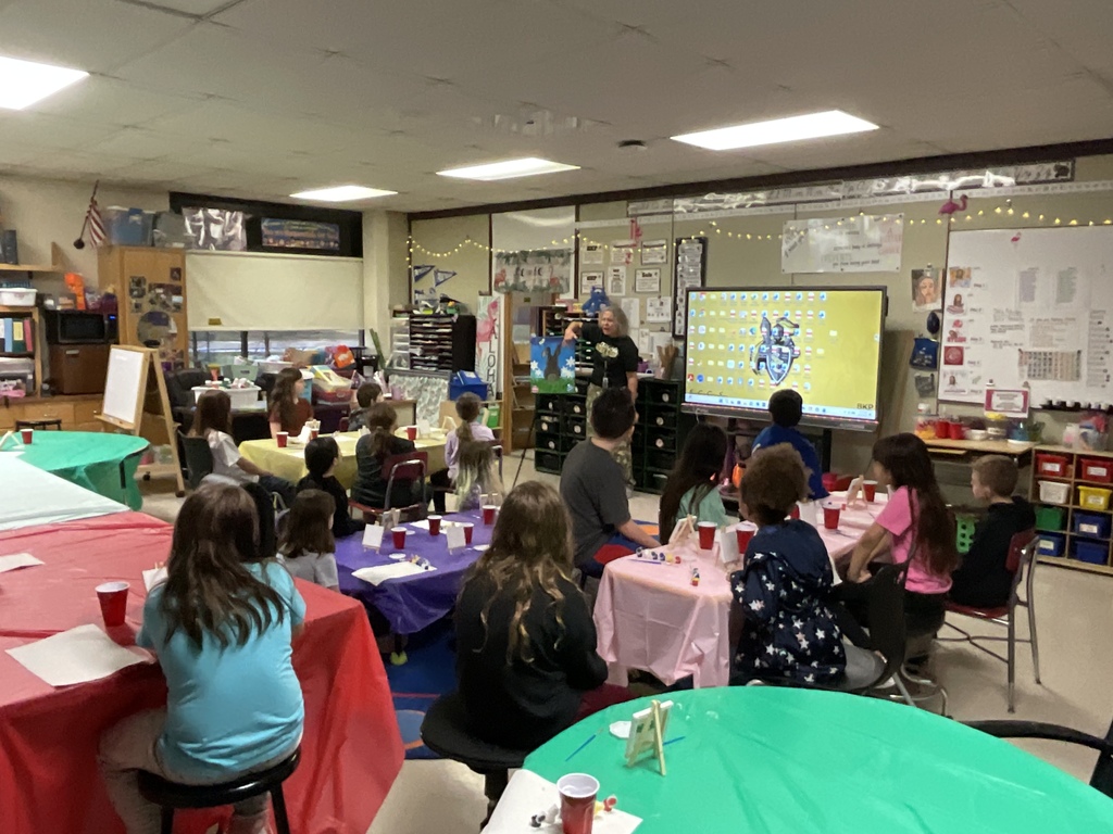 The students prepare to paint bunnies