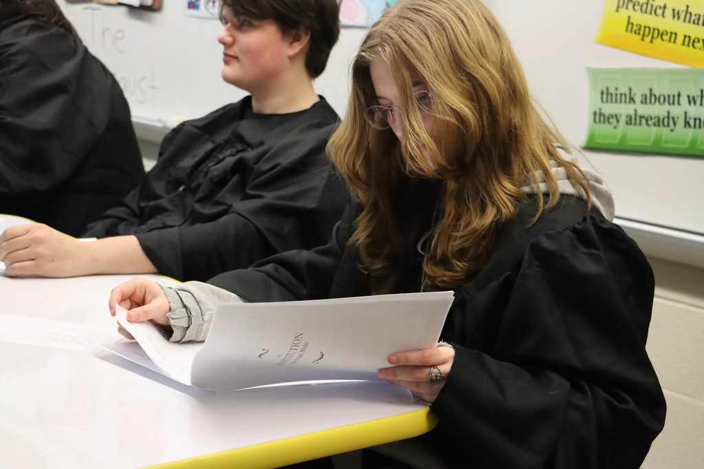 a student judge reads the constitution