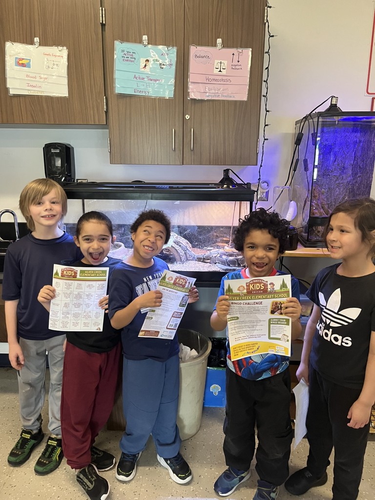 elementary students in the science classroom by the snake cages