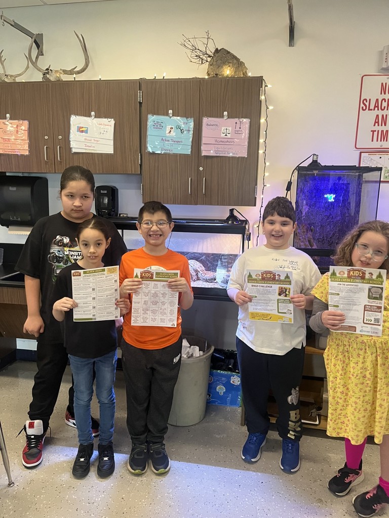 elementary students in the science classroom by the snake cages