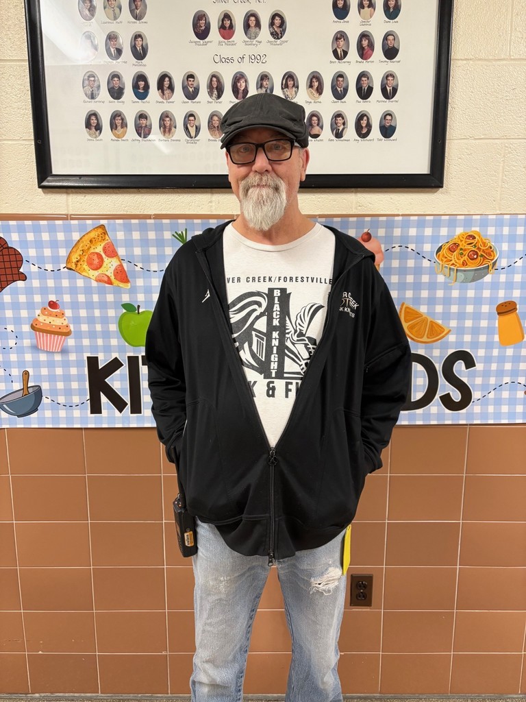 Mr. Mark standing in hall