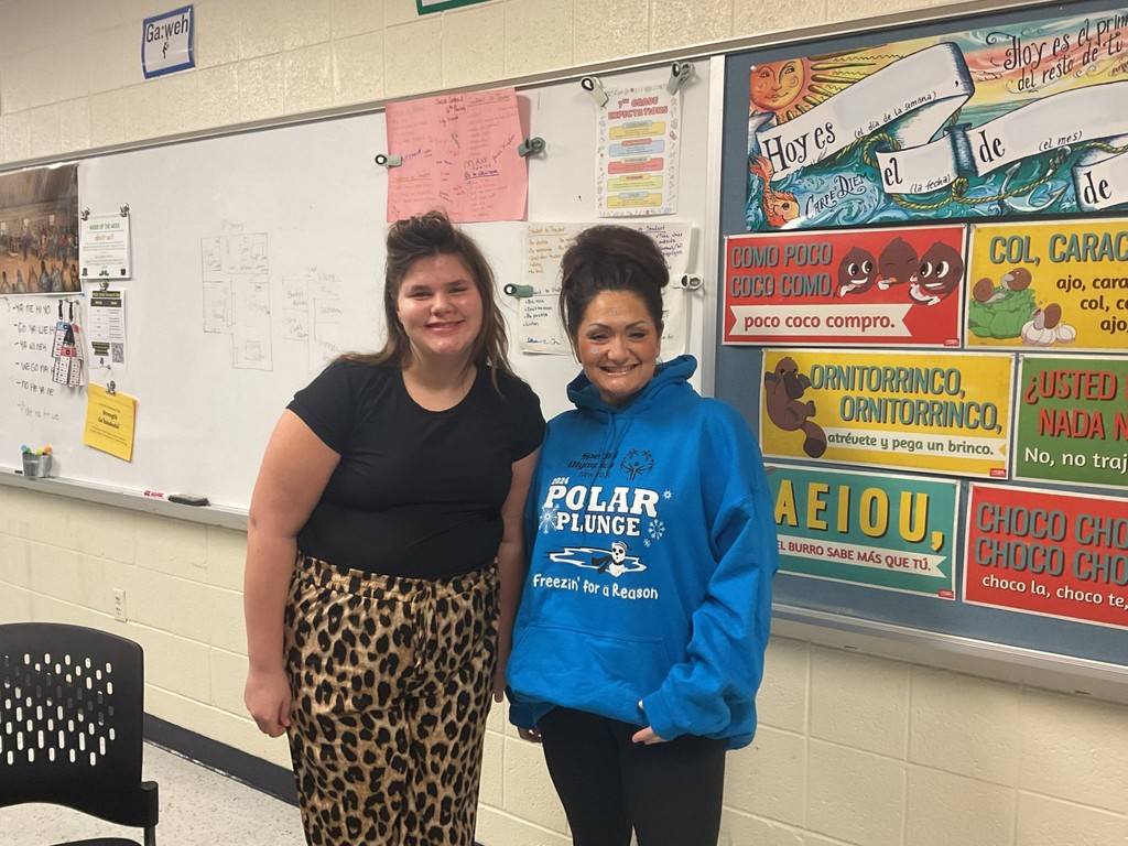 Mrs. Prinzbach and a student pose in a classroom