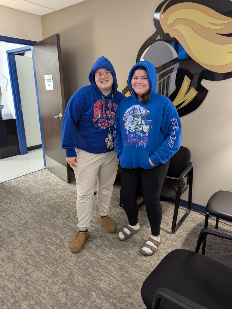 two people in blue hoodies