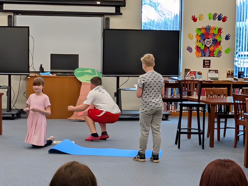 Students in costume acting out Greek plays