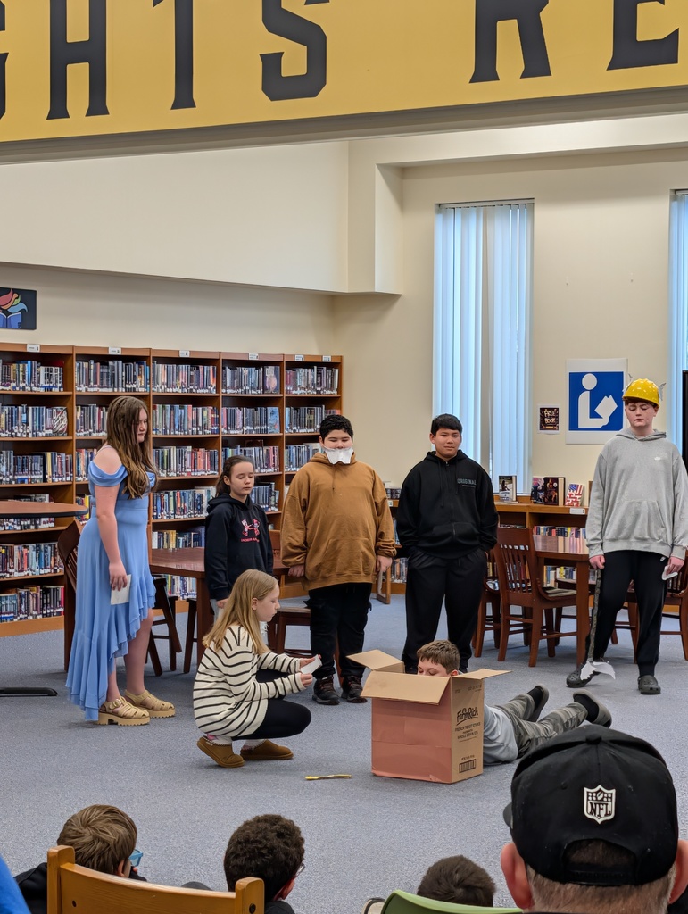 Students in costume acting out Greek plays
