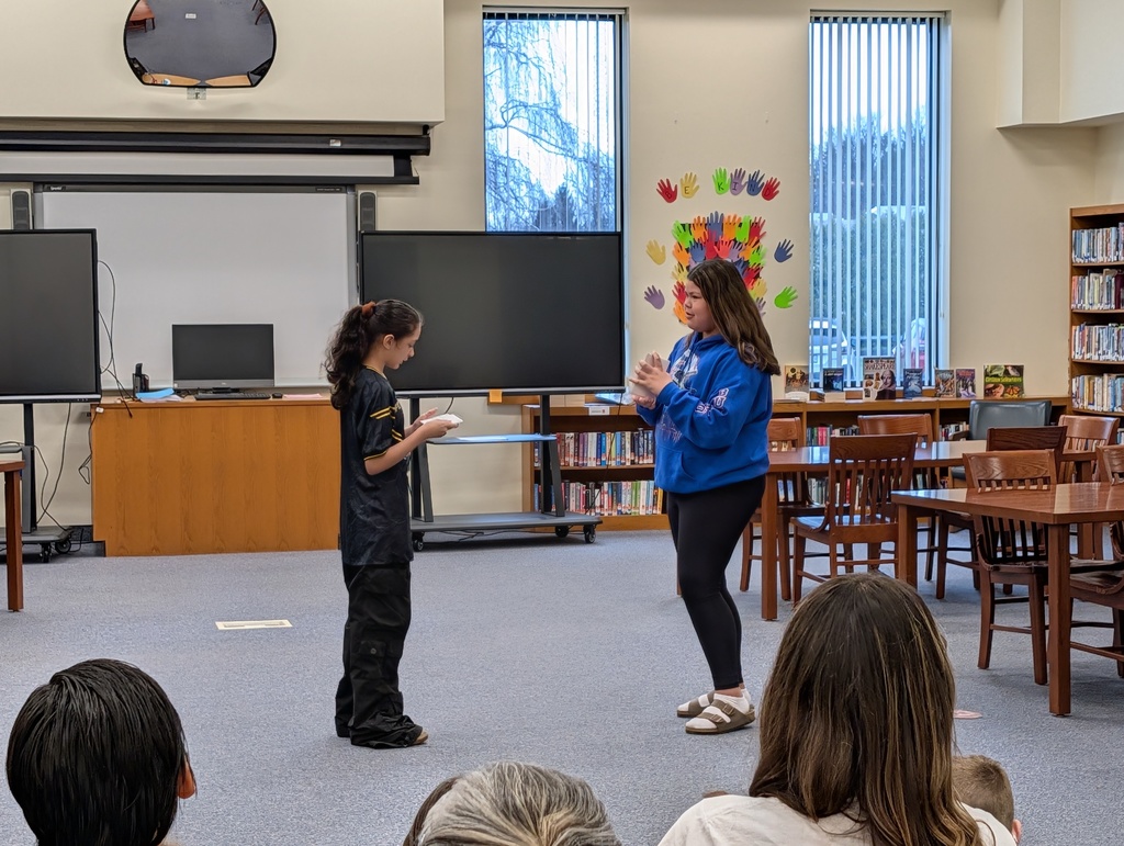 Students in costume acting out Greek plays