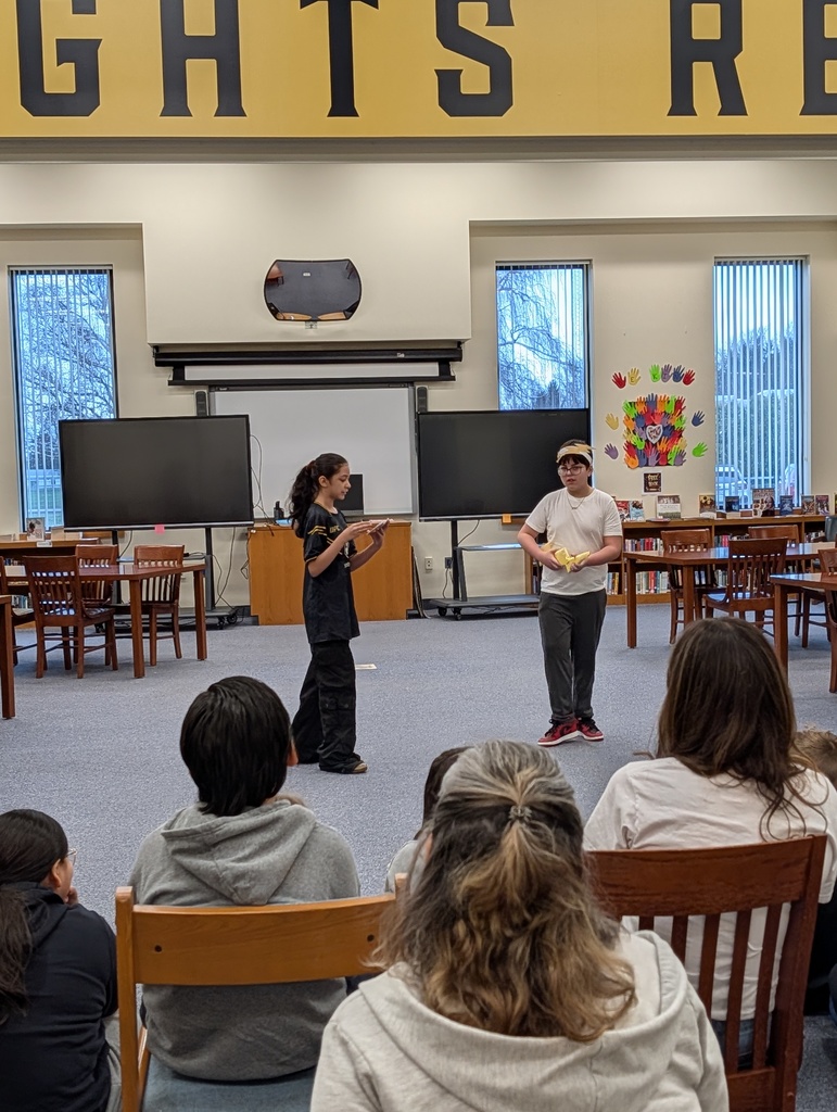 Students in costume acting out Greek plays