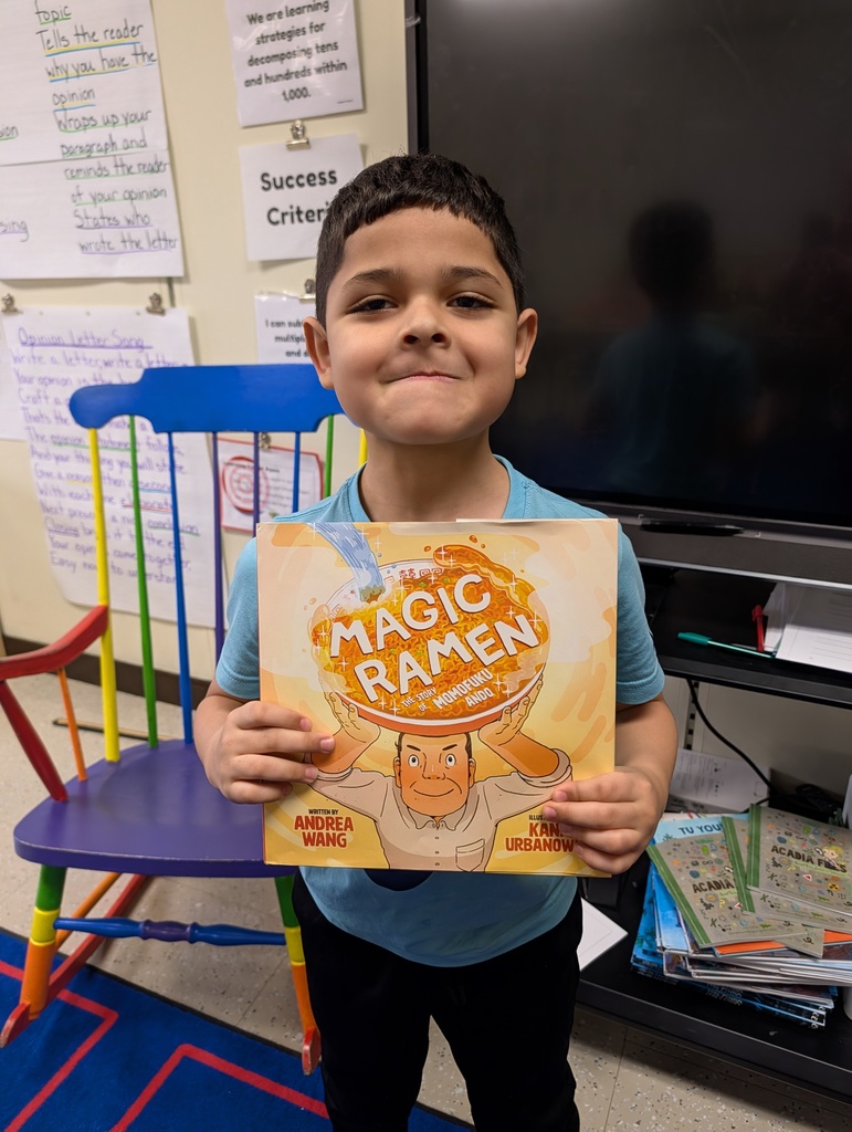 A student holds the Magic Ramen book