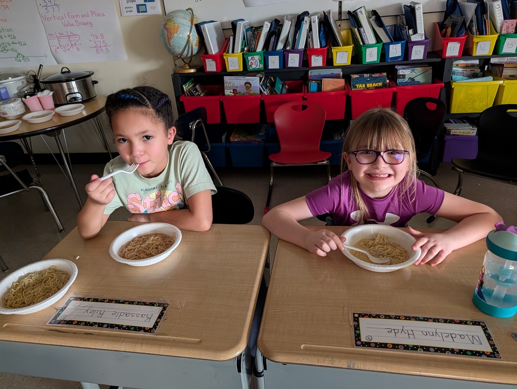 two students eat ramen