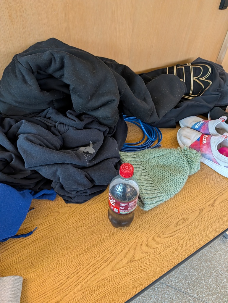 Hoodies in a pile on a table