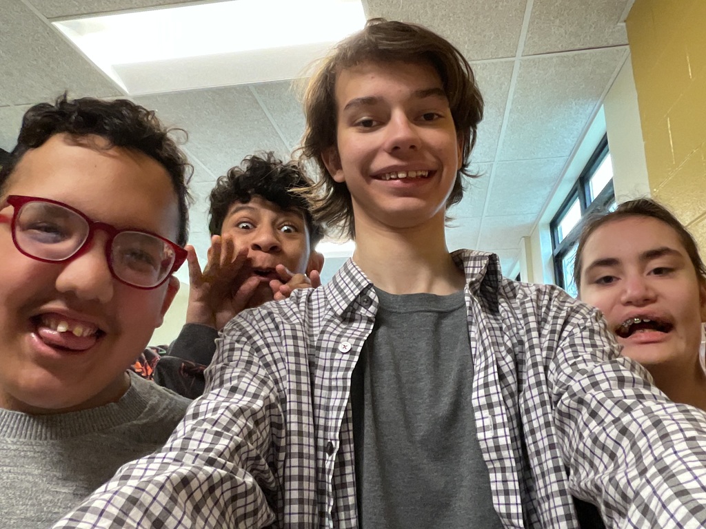 students pose and smile for the camera