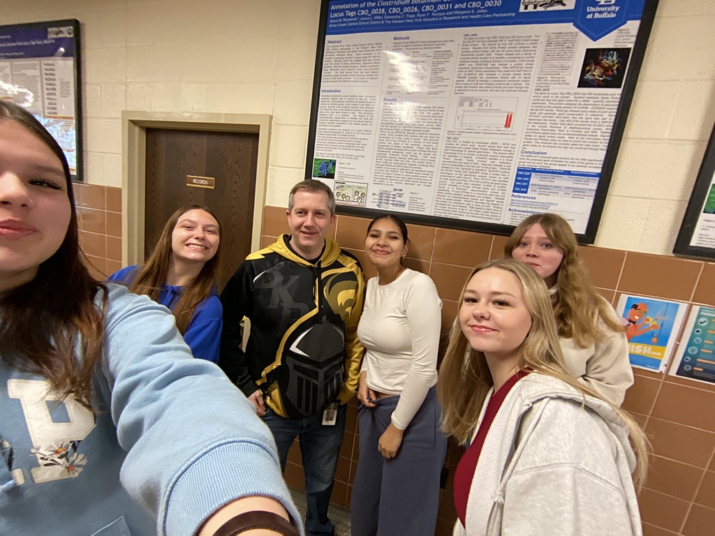 Students pose with Mr. Austin-Alford