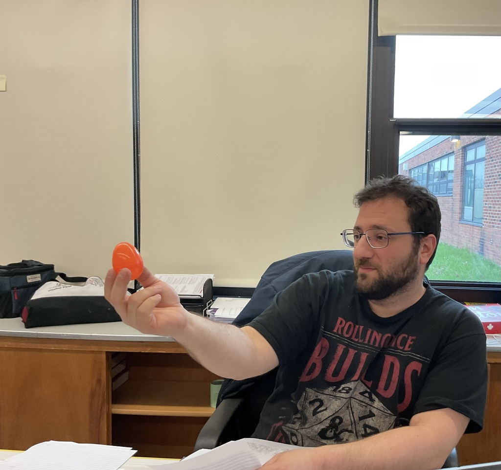 Mr. DiGennaro holds an orange egg