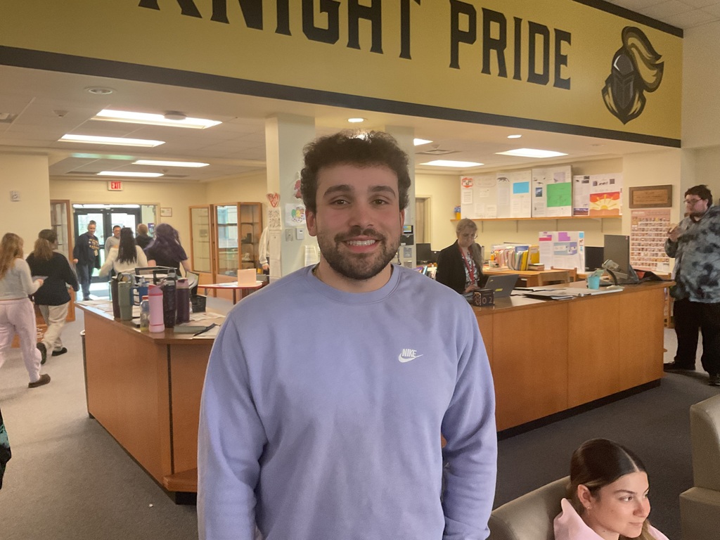 Mr. Shuart smiles in the library