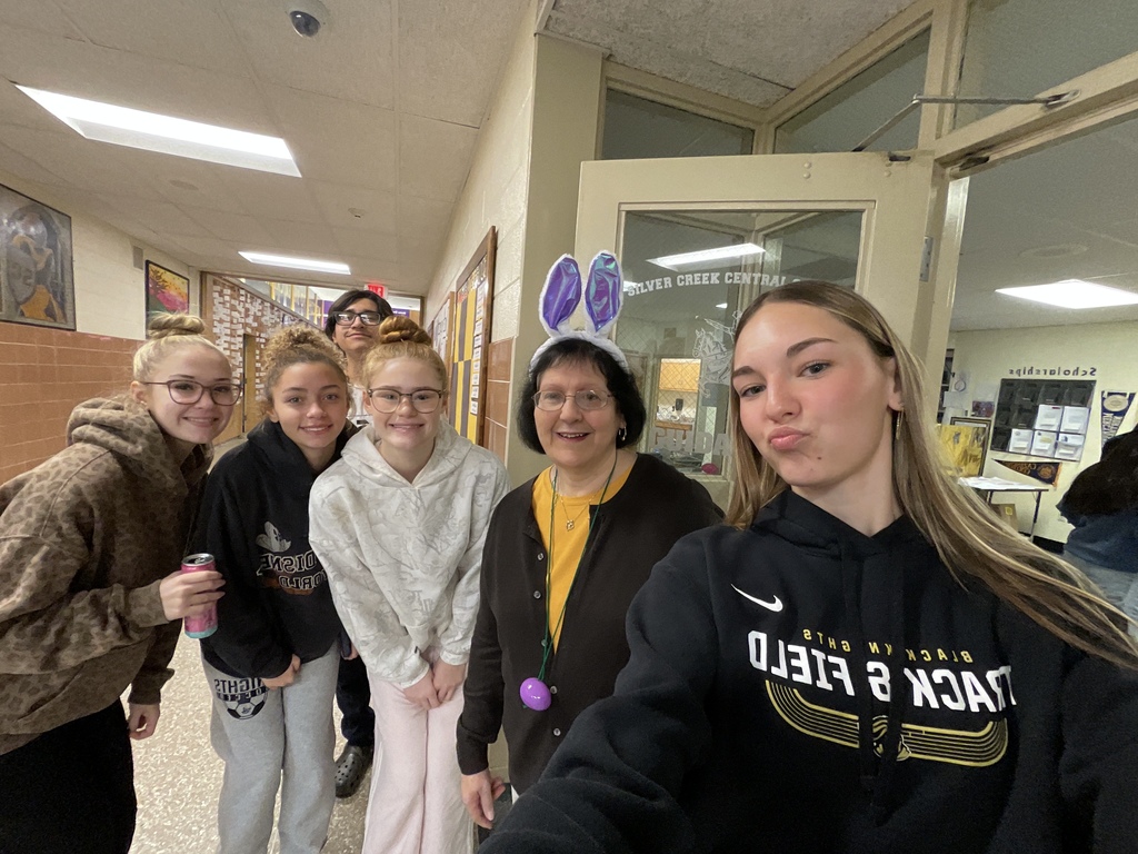 Students pose with Mrs. Congdon in bunny ears