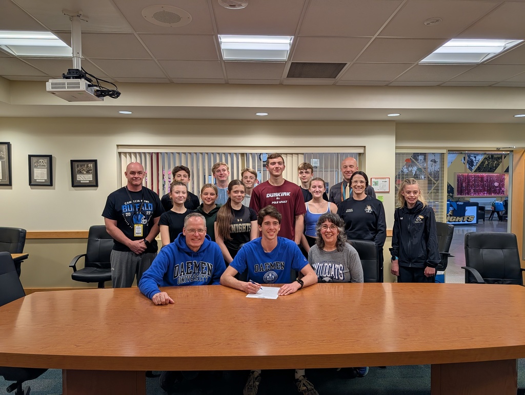 Sam with parents, coaches and track team