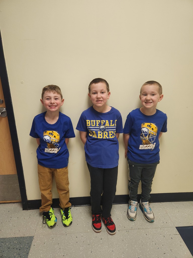 Three students wear Sabres shirts