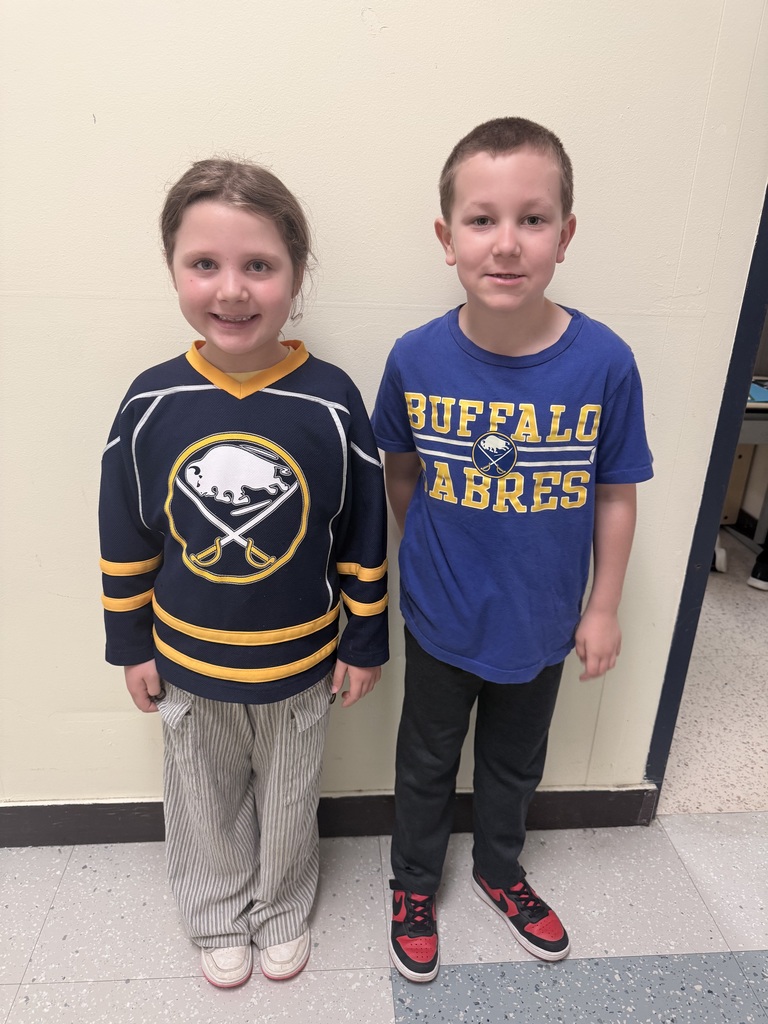 Two students wear Sabres shirts.