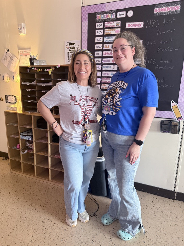 Two teachers wear Sabres shirts. 