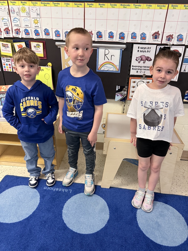 Three students wear Sabres shirts.