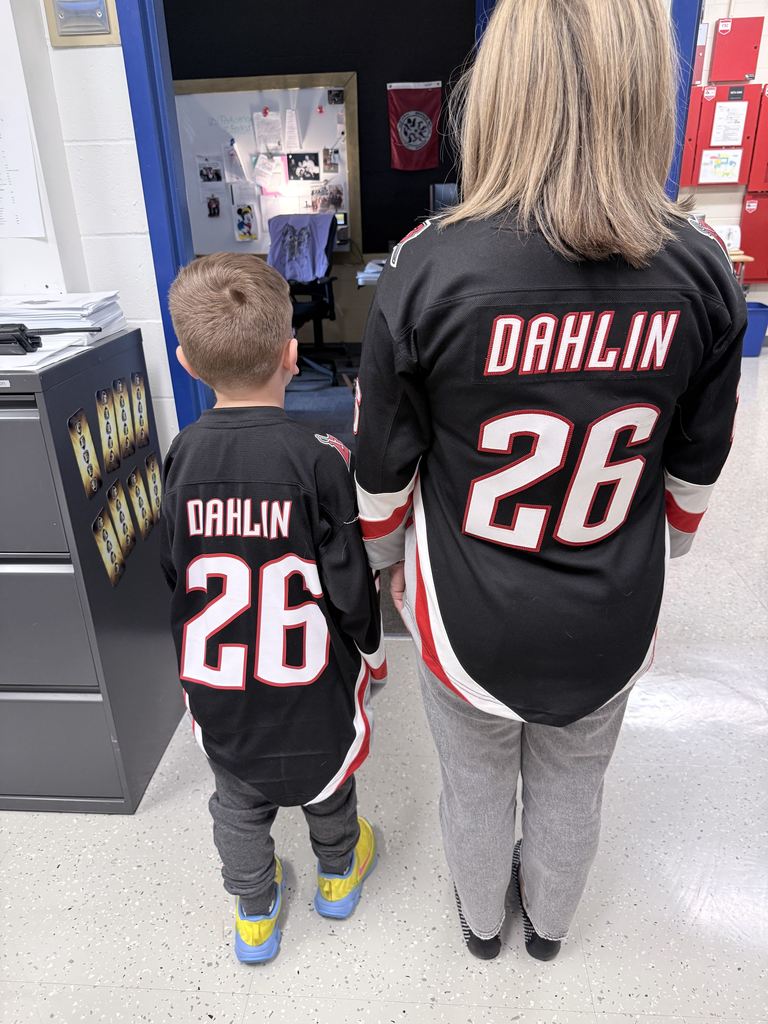 Mrs. Radoani and student in Dahlin Sabres jerseys back view