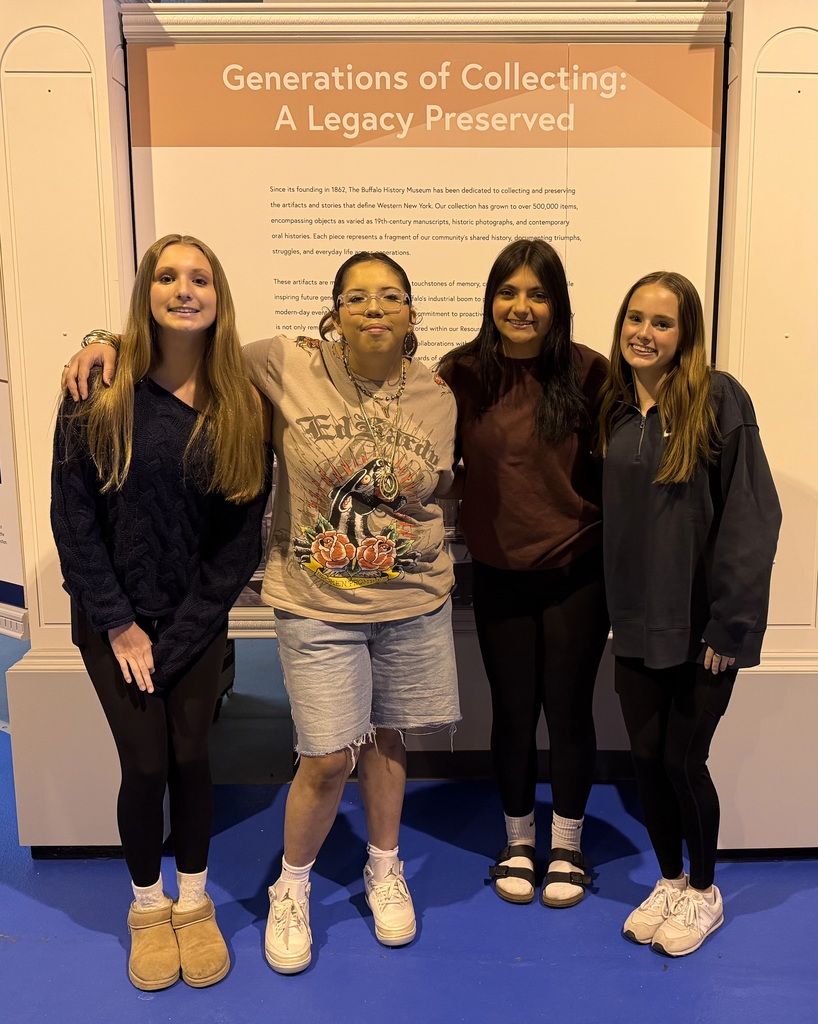 Four students at the museum. 