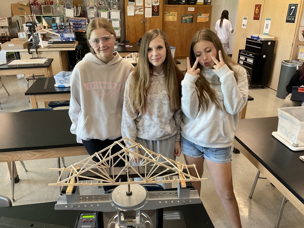 Autumn, Lydia and Lilly pose with their bridge