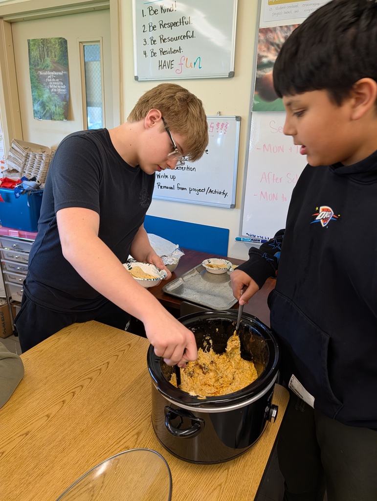 students serving wing dip from crock pot