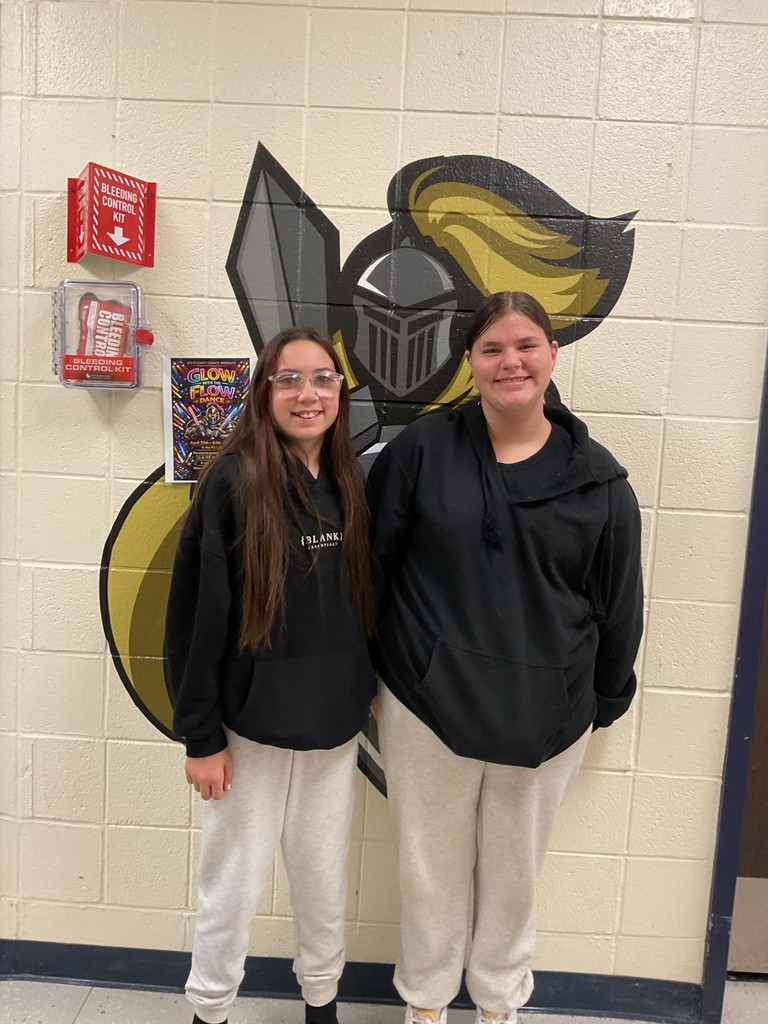 Middle school girls in black sweatshirts and gray sweatpants