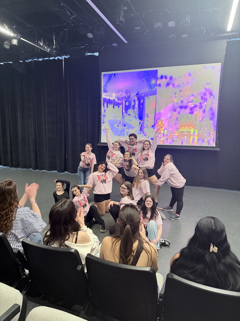 students performing dances on stage