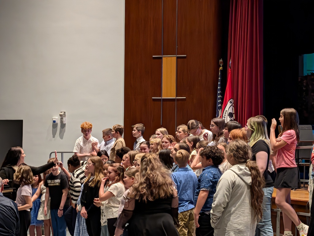 Elementary chorus on risers performing