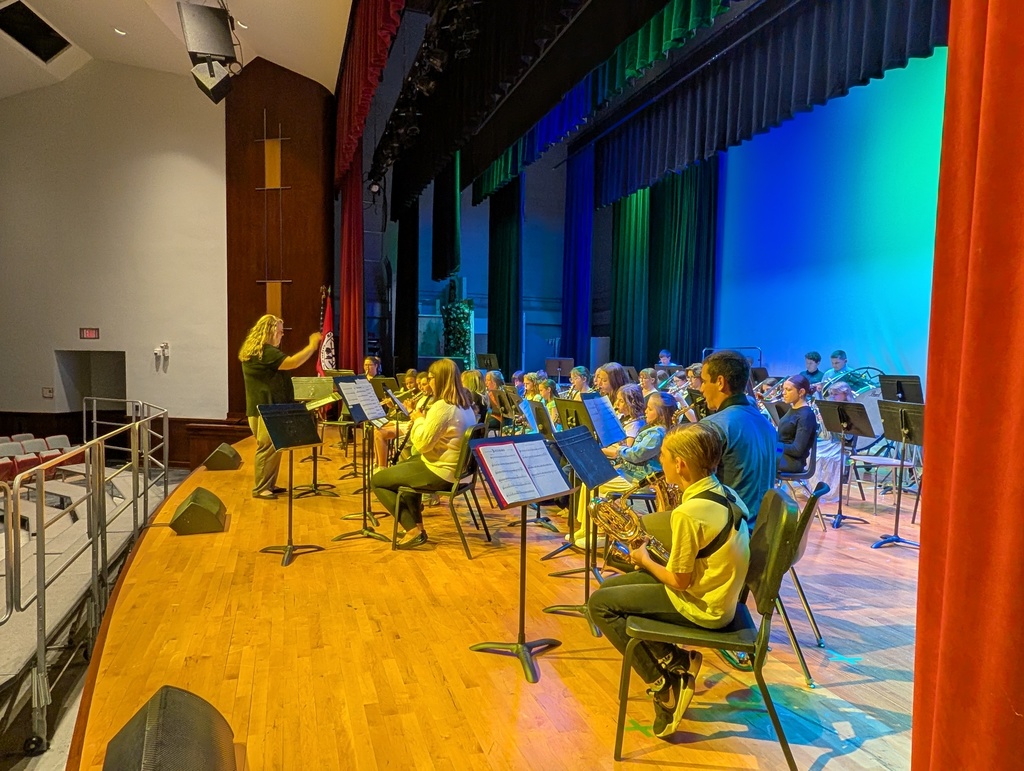 Ms. Bachowski directing band on stage