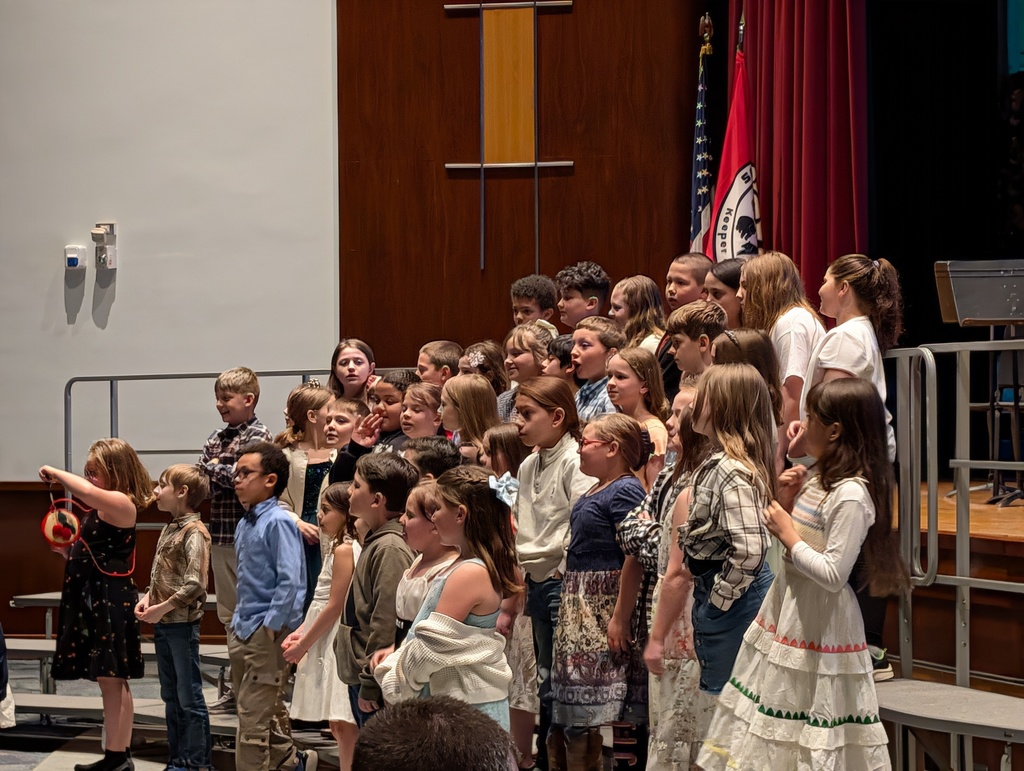 Elementary chorus on risers performing