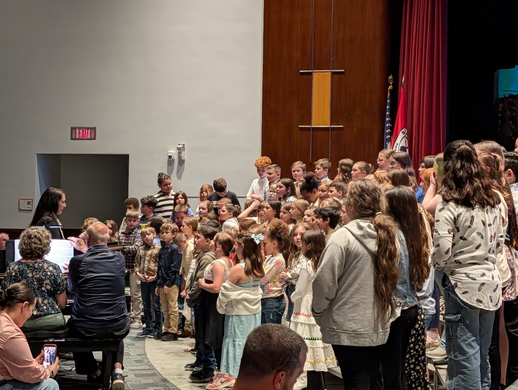 Elementary chorus on risers performing