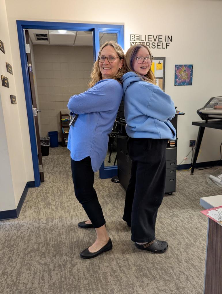 Ms. Tothero and student in blue sweater and black pants