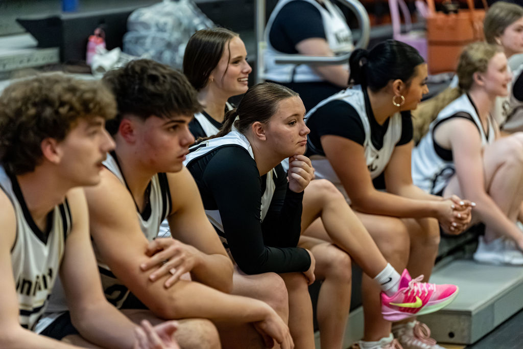 SC players smile as they watch from the sidelines