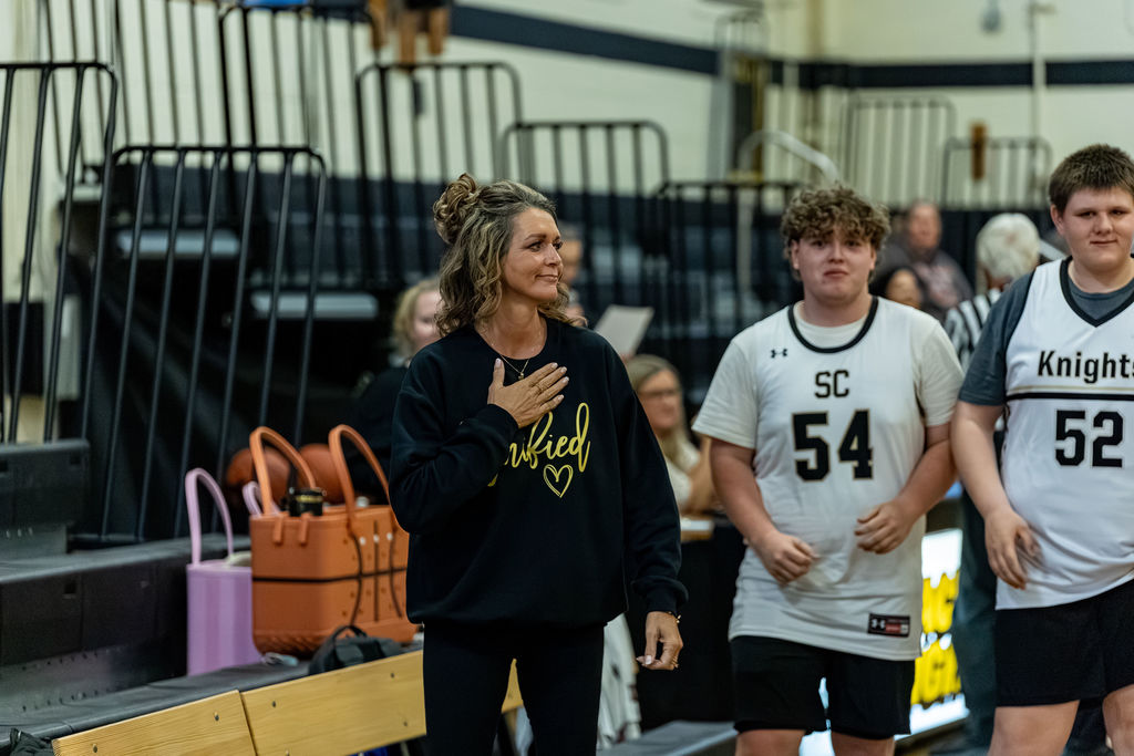 Coach Johnson looks on at her players