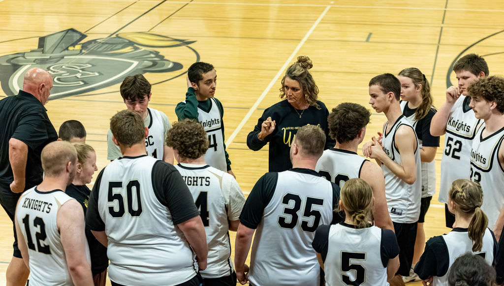 Coach Johnson talks with the team