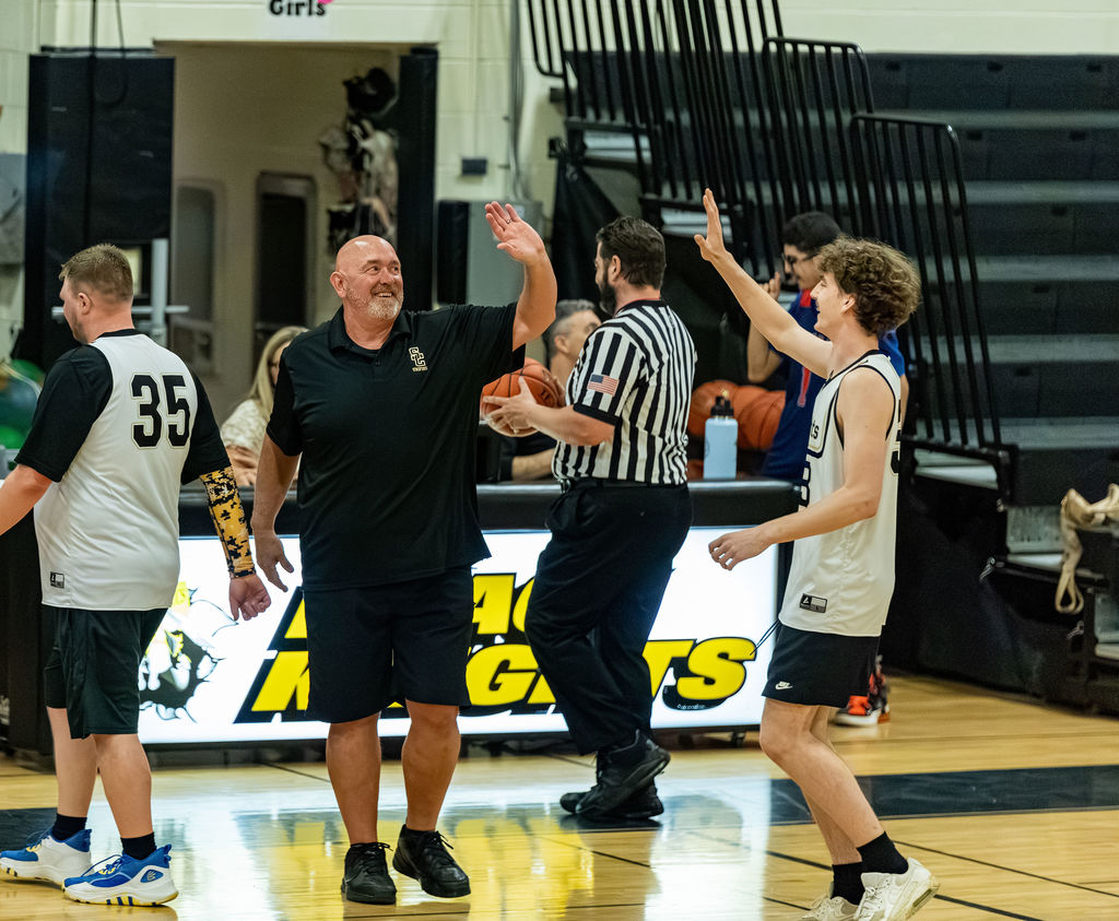 a player high fives Deputy Johnson