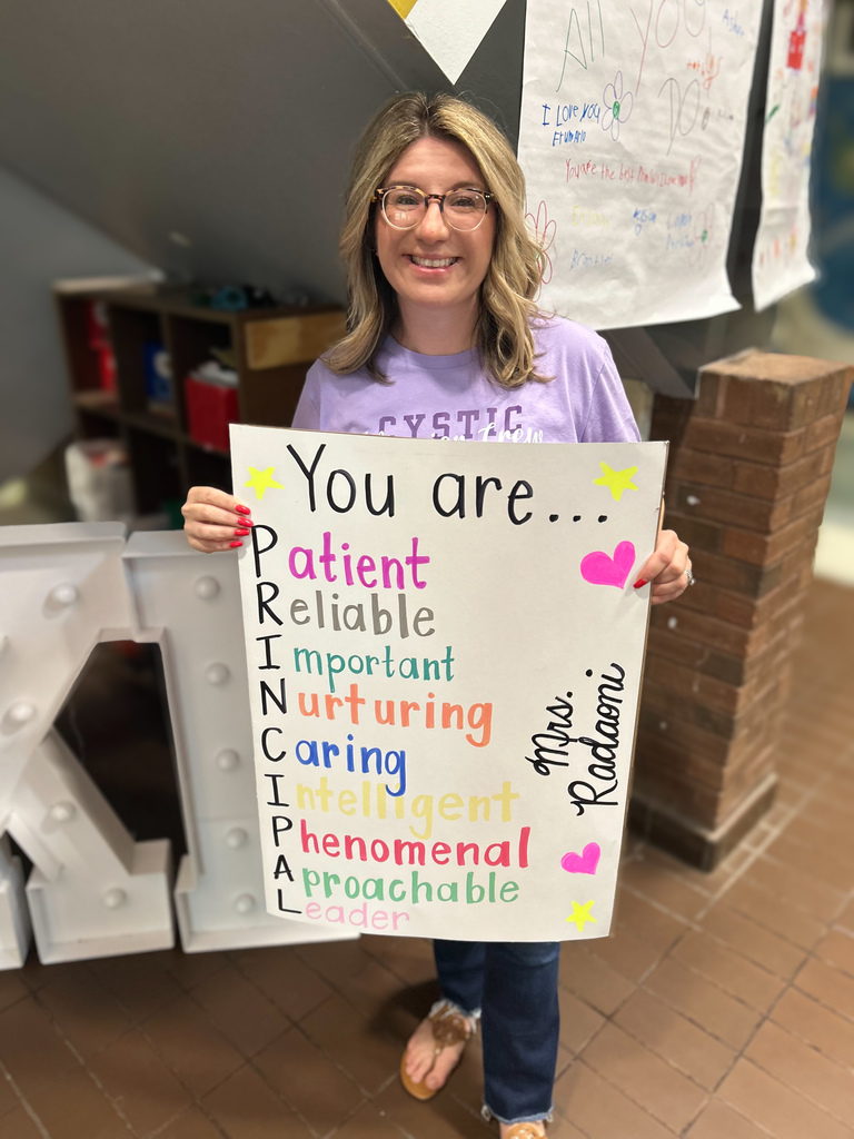 Mrs. Radoani holding her poster